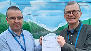 Scottish Water's General Manager Gordon Reid and Delivery Manager Ian Watt with BSI certificate