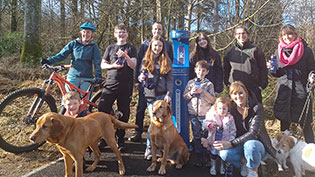 Group of people with bike and dogs