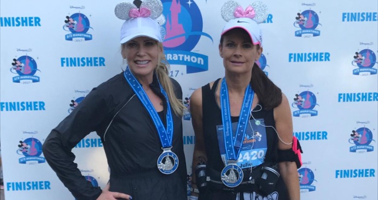 Lesley (left) Julie (right) pictured with their medals on after completing the Disneyland Paris Half Marathon in 2019.